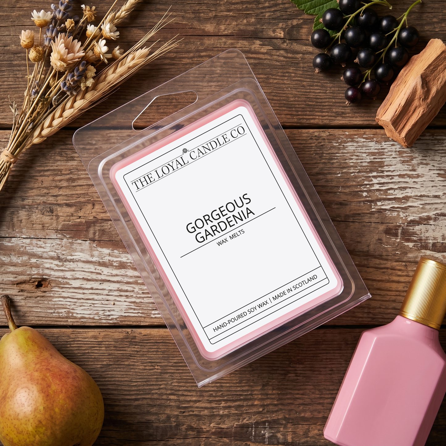 Gorgeous Gardenia wax melt clamshell on a dark wood background.